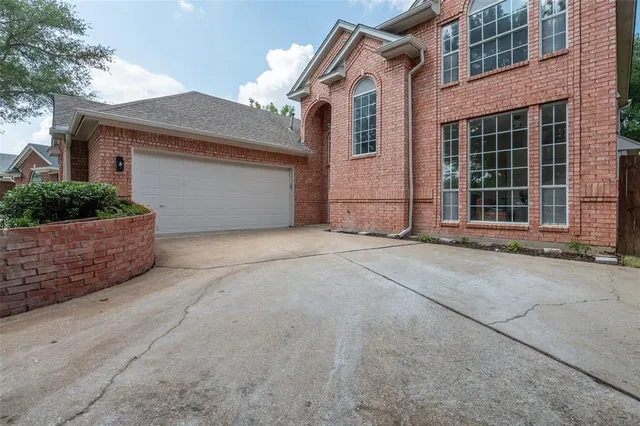 a front view of a house with a garage