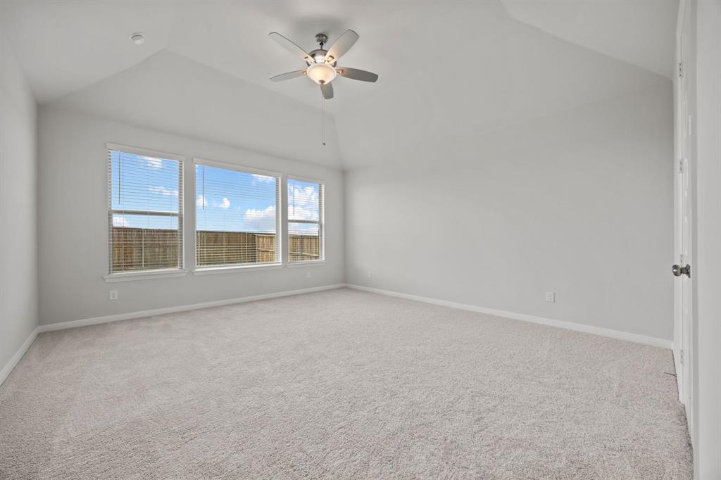 1502 Red Clover Avenue Van Alstyne, TX 75495 - Photo 14 of 27 an empty room with a window and ceiling fan
