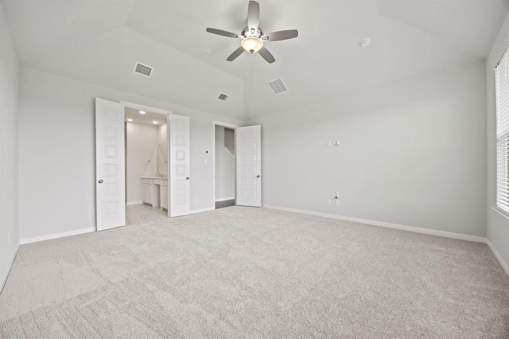 1502 Red Clover Avenue Van Alstyne, TX 75495 - Photo 15 of 27 an empty room with a ceiling fan and a ceiling fan