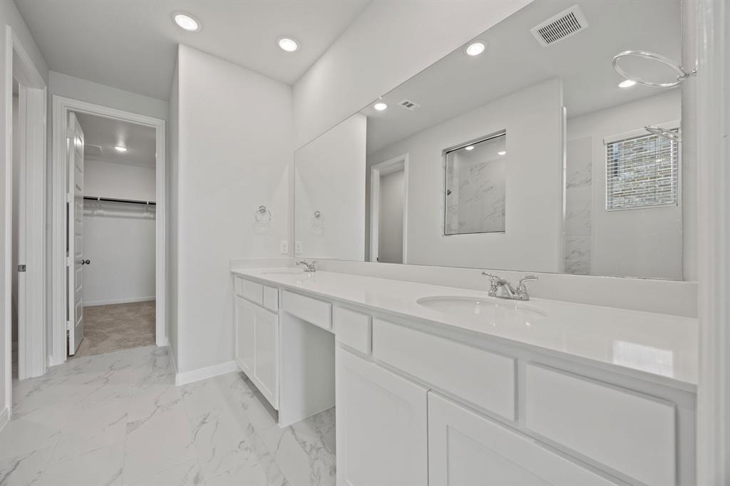 1502 Red Clover Avenue Van Alstyne, TX 75495 - Photo 16 of 27 a bathroom with a sink a shower and a mirror
