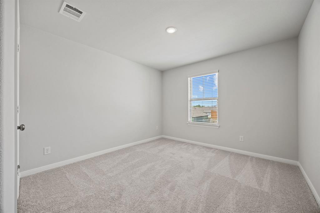 1502 Red Clover Avenue Van Alstyne, TX 75495 - Photo 18 of 27 a view of an empty room with a window