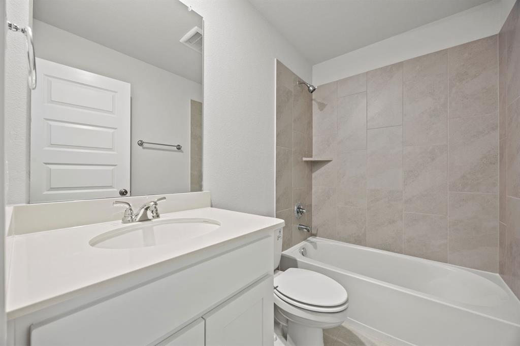 1502 Red Clover Avenue Van Alstyne, TX 75495 - Photo 19 of 27 a bathroom with a sink toilet and shower
