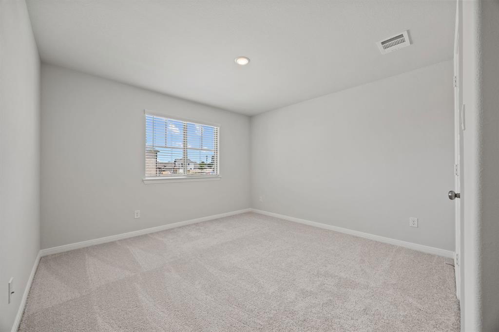 1502 Red Clover Avenue Van Alstyne, TX 75495 - Photo 20 of 27 a view of an empty room with a window