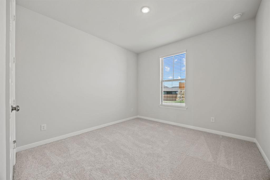 1502 Red Clover Avenue Van Alstyne, TX 75495 - Photo 23 of 27 a view of an empty room with a window
