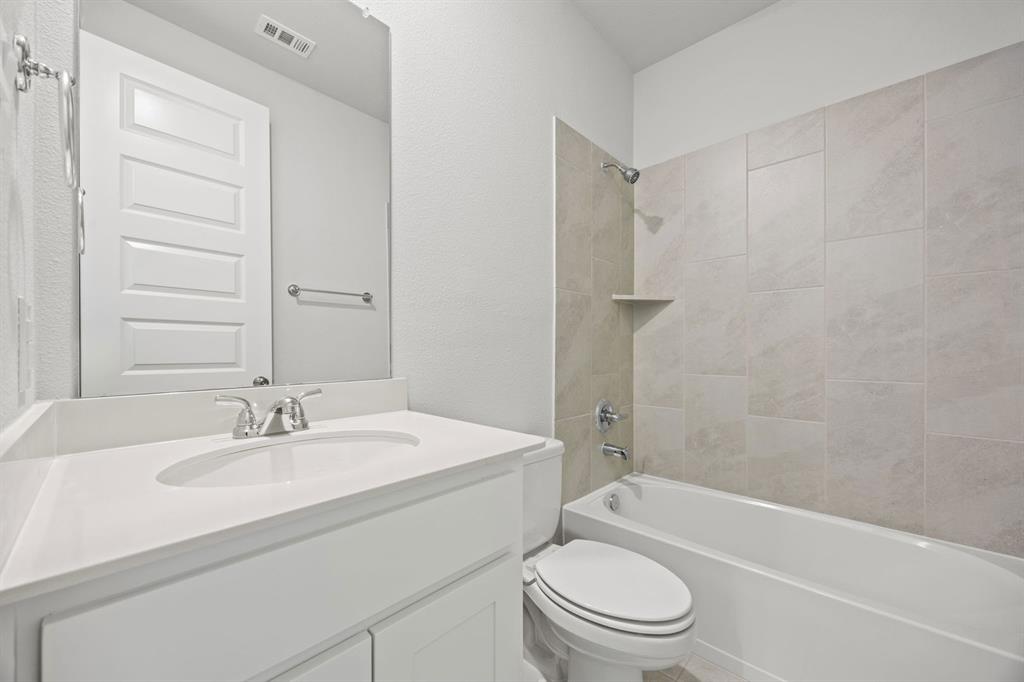 1502 Red Clover Avenue Van Alstyne, TX 75495 - Photo 24 of 27 a bathroom with a sink toilet and shower
