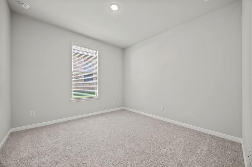 1502 Red Clover Avenue Van Alstyne, TX 75495 - Photo 25 of 27 an empty room with a window