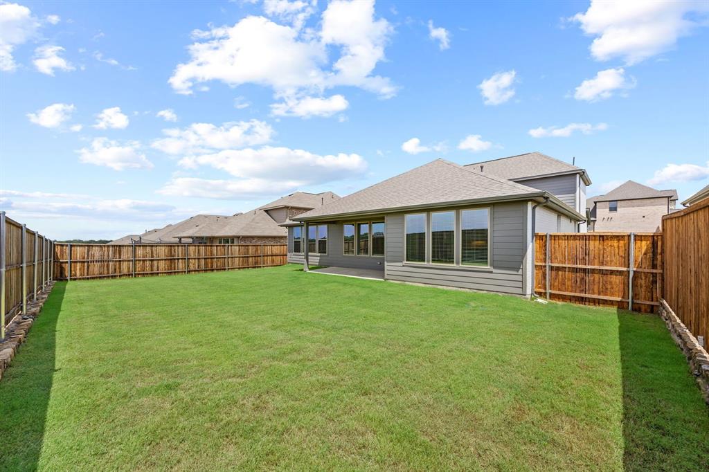 1502 Red Clover Avenue Van Alstyne, TX 75495 - Photo 27 of 27 a view of an house with backyard space and balcony