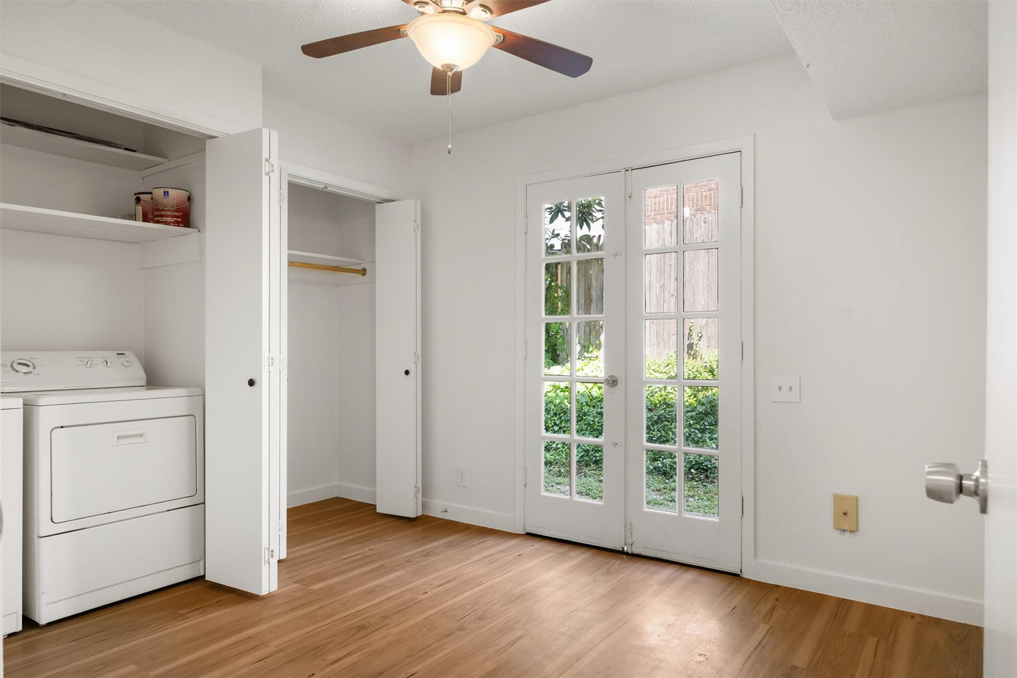 620 South 1st Street, Unit 116 Austin, TX 78704 - Photo 14 of 19 a view of a kitchen with a dishwasher cabinets and wooden floor