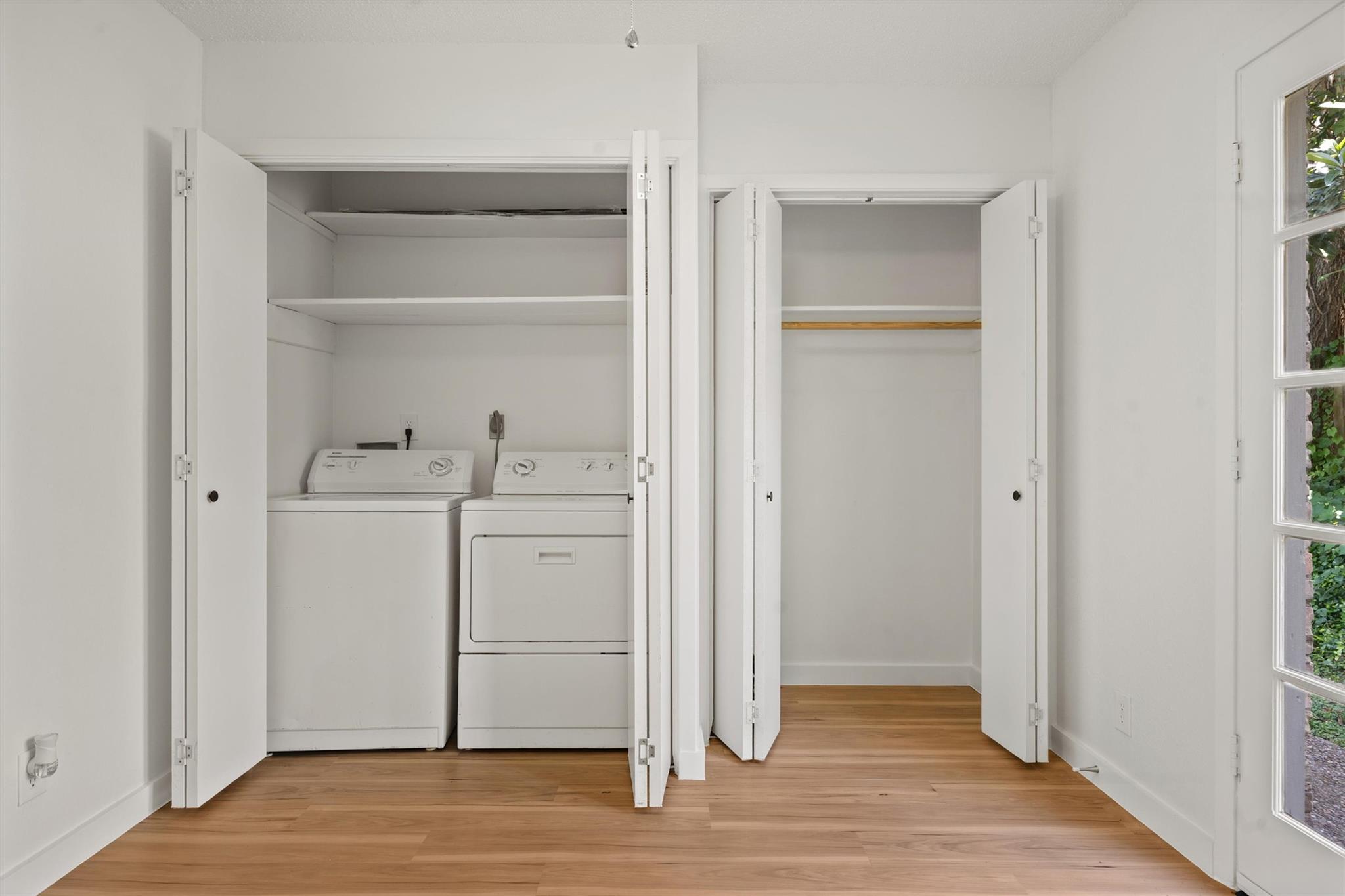 620 South 1st Street, Unit 116 Austin, TX 78704 - Photo 15 of 19 a view of storage and utility room with wooden floor