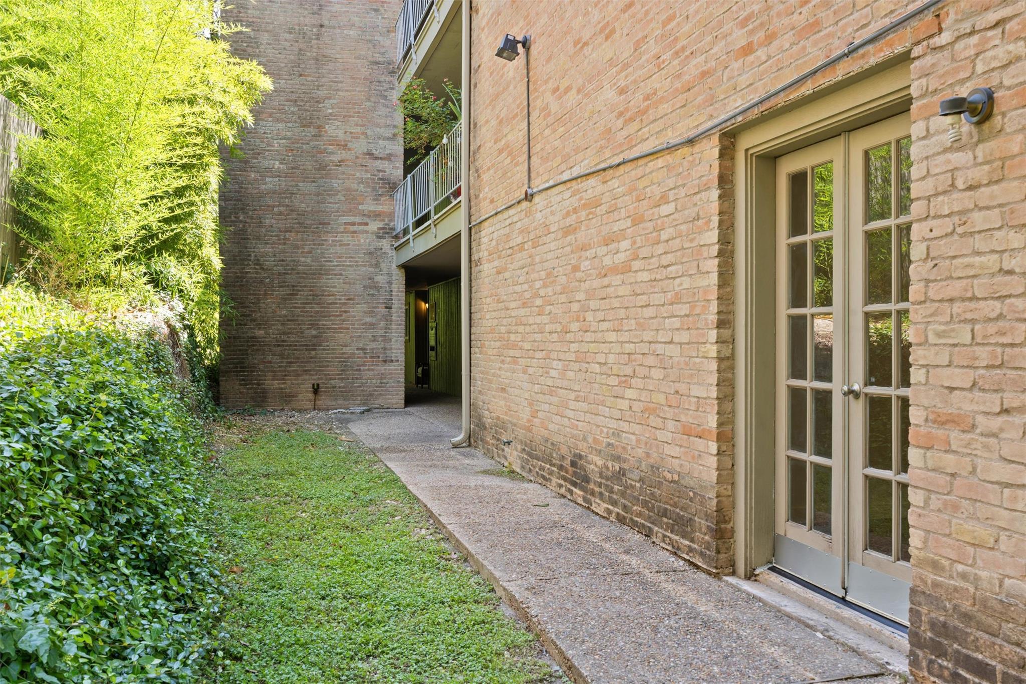 620 South 1st Street, Unit 116 Austin, TX 78704 - Photo 16 of 19 a view of house with backyard