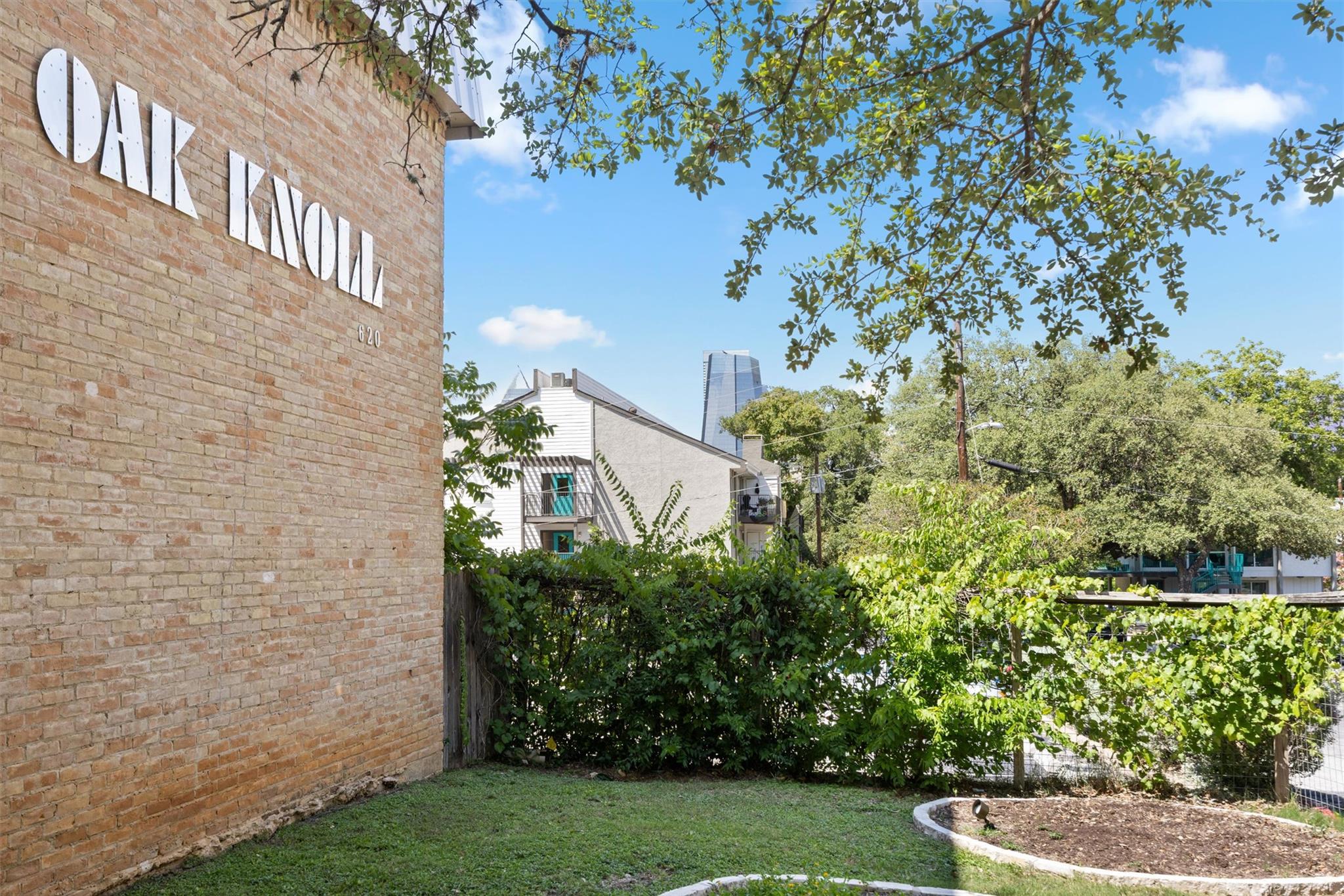 620 South 1st Street, Unit 116 Austin, TX 78704 - Photo 18 of 19 a view of a garden with a fountain