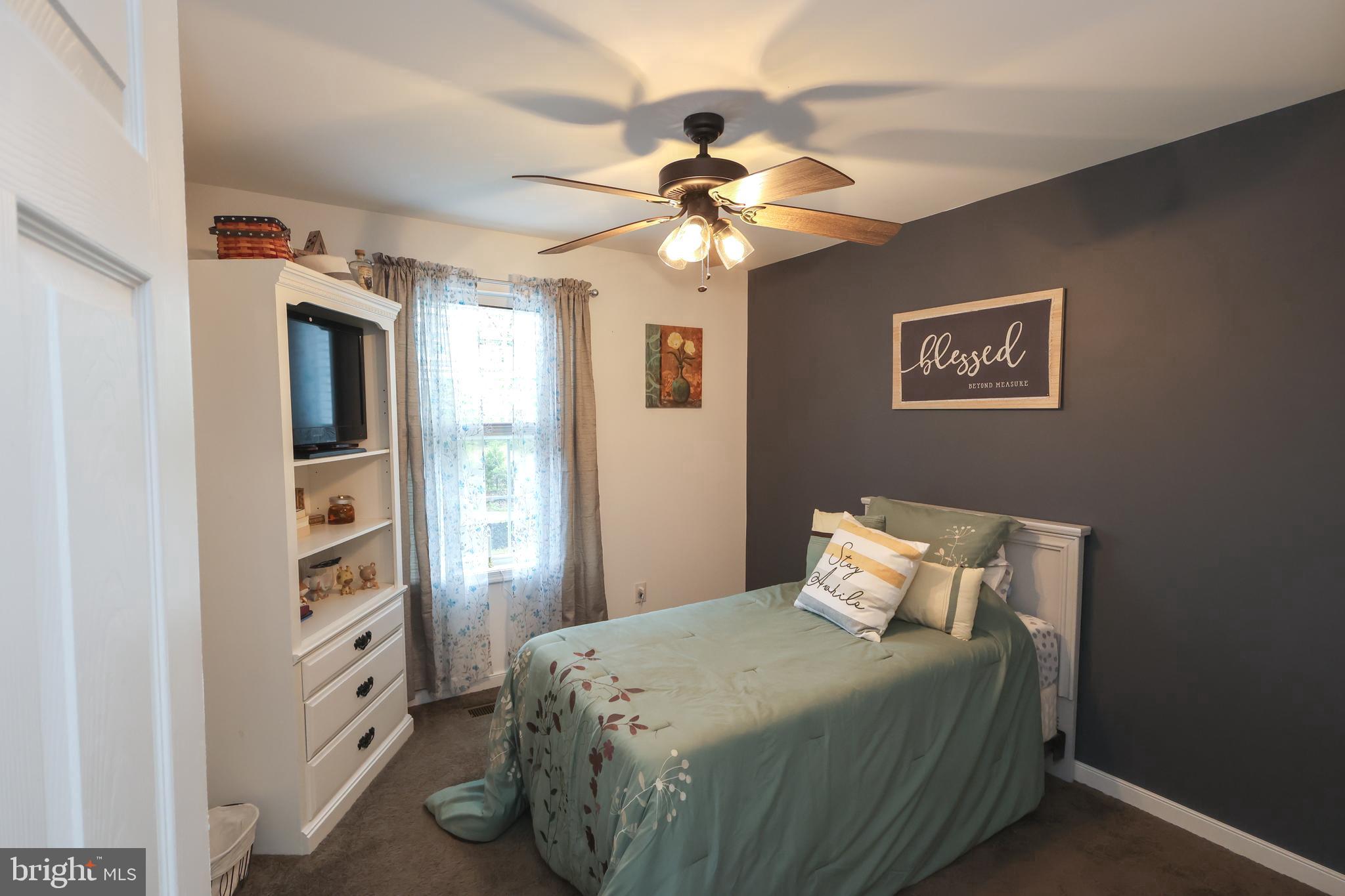 16919 Shaffer Road Sharpsburg, MD 21782 - Photo 24 of 58 a bedroom with a large bed and a window