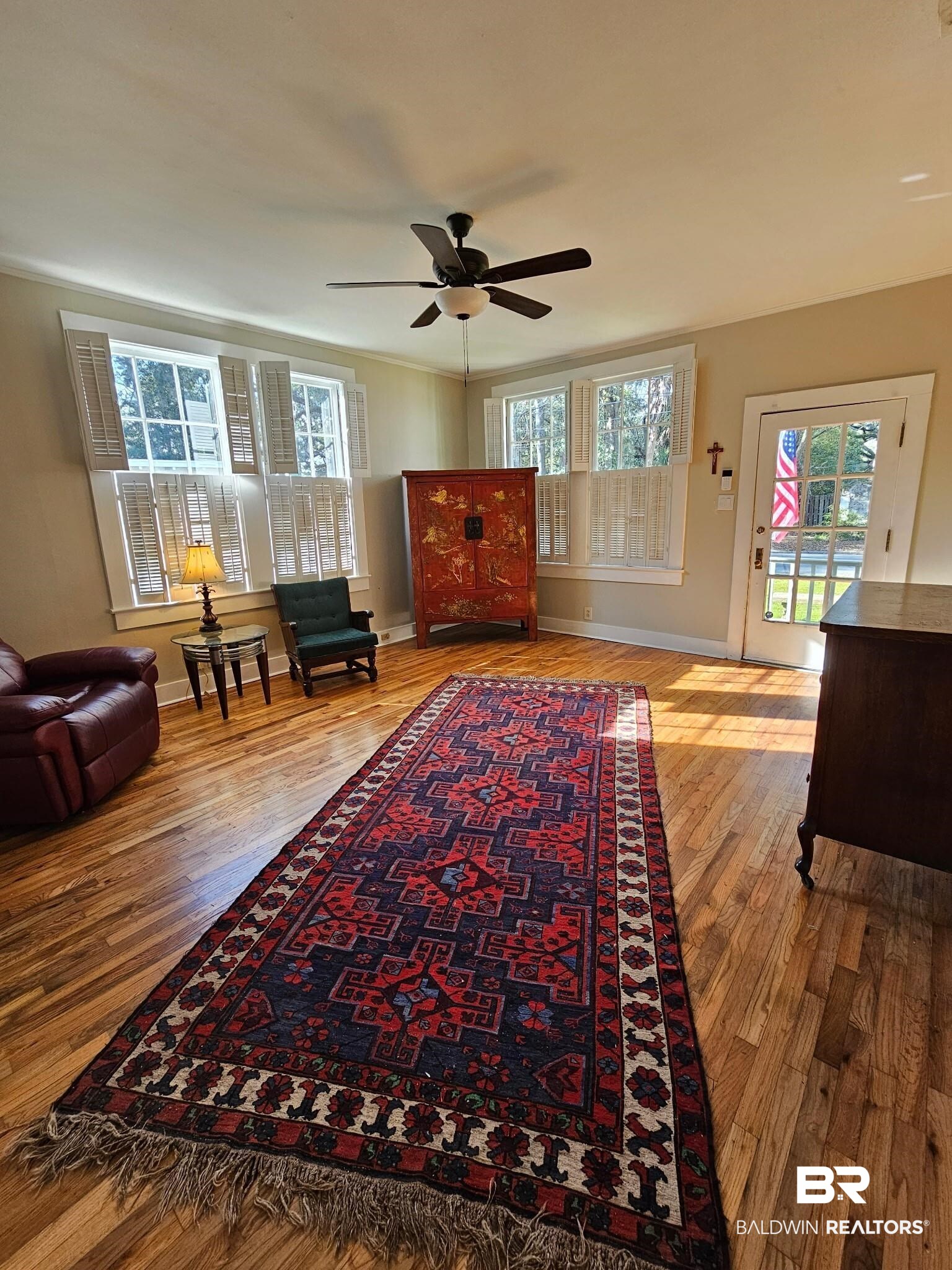 1215 Church Street Mobile, AL 36604 - Photo 3 of 23 Sitting room featuring a ceiling fan, baseboards, and wood finished floors