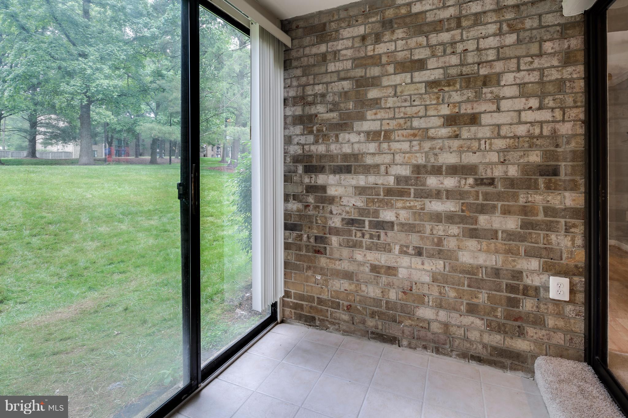 10547 Twin Rivers Road, Unit B1 Columbia, MD 21044 - Photo 17 of 30 Enclosed Porch with Ceramic Flooring