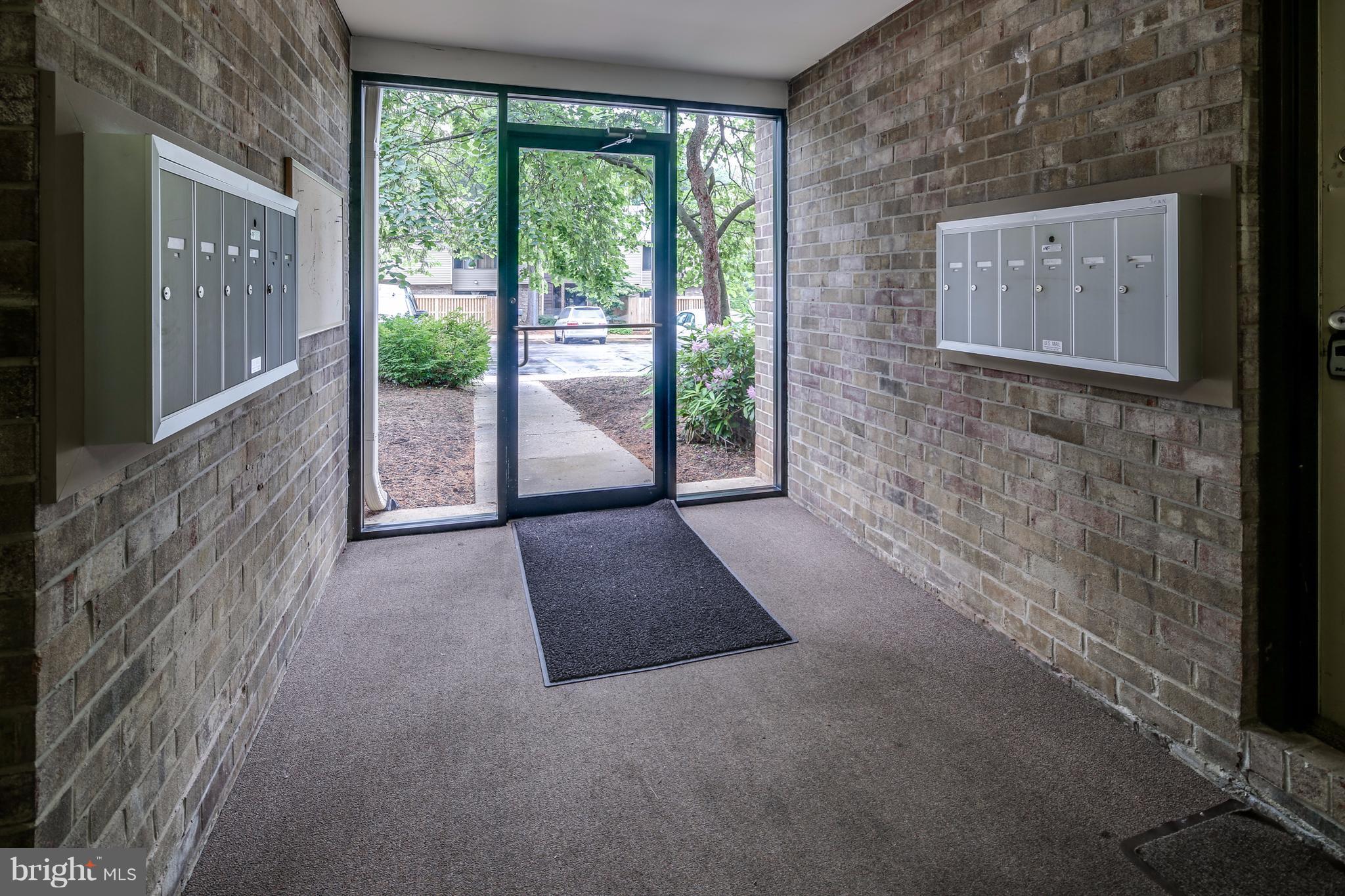 10547 Twin Rivers Road, Unit B1 Columbia, MD 21044 - Photo 3 of 30 Main Door with Mailbox Area