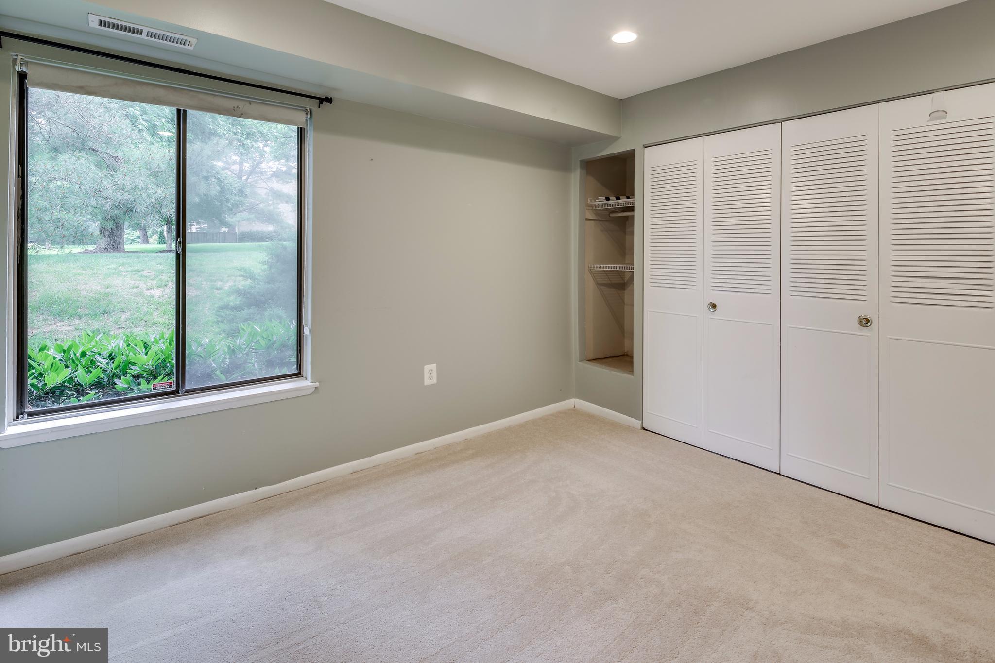 10547 Twin Rivers Road, Unit B1 Columbia, MD 21044 - Photo 23 of 30 Bedroom #2 with Large Closet + Open Shelving
