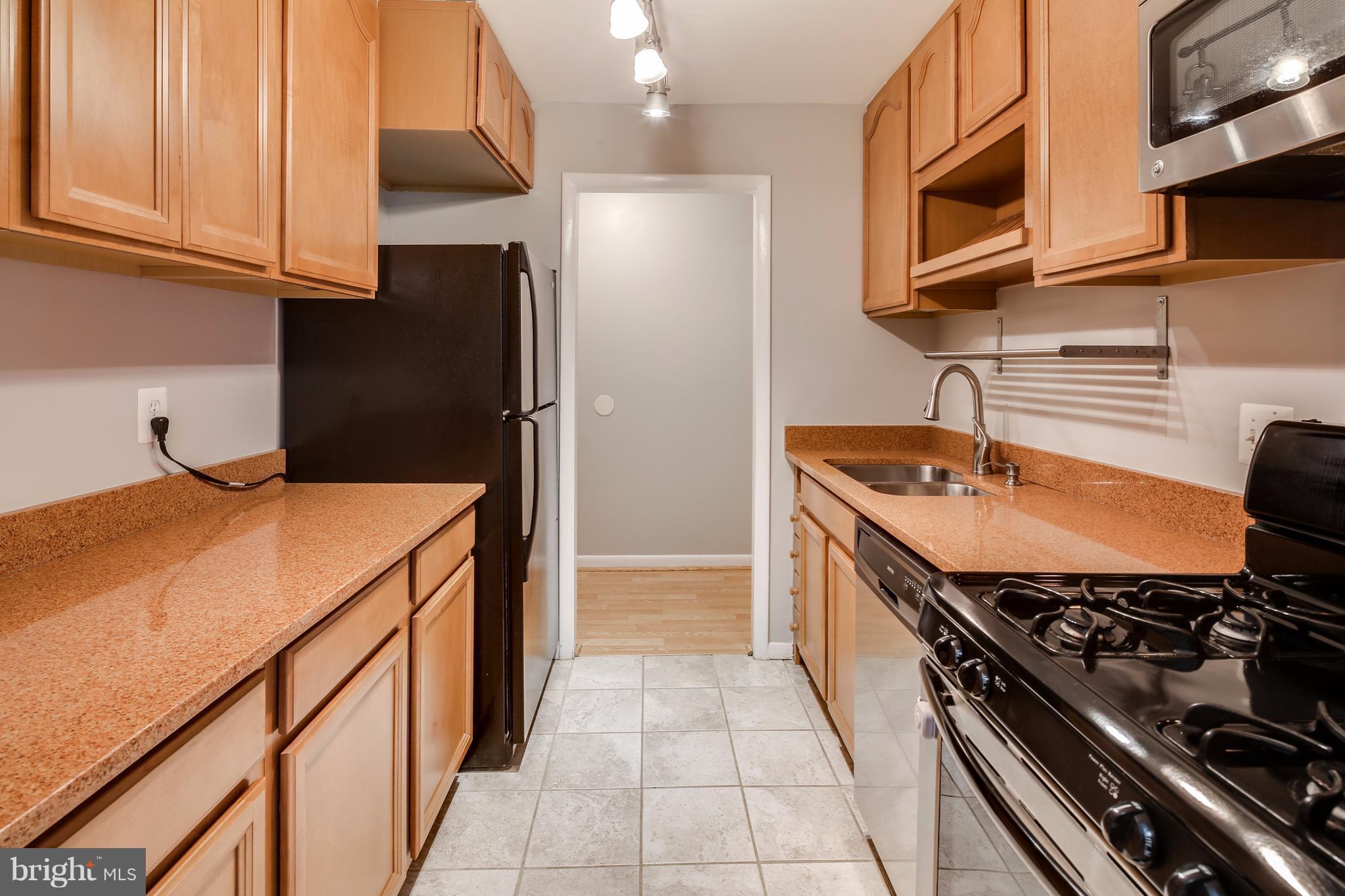 10547 Twin Rivers Road, Unit B1 Columbia, MD 21044 - Photo 6 of 30 Stainless Steel Stove, DW & Microwave