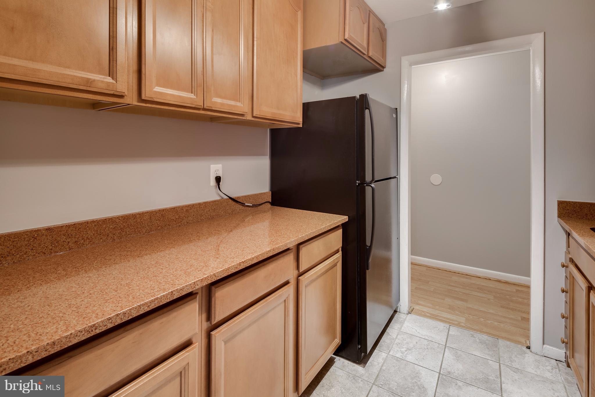 10547 Twin Rivers Road, Unit B1 Columbia, MD 21044 - Photo 7 of 30 Tall Wood Cabinetry