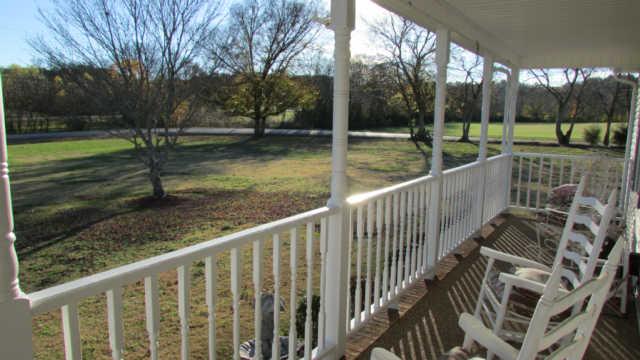 3320 Booker Ridge Road Mount Pleasant, TN 38474 - Photo 11 of 13 COVERED ROCKING CHAIR FRONT PORCH
