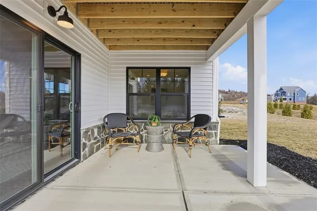 a view of a patio with table and chairs and potted plants