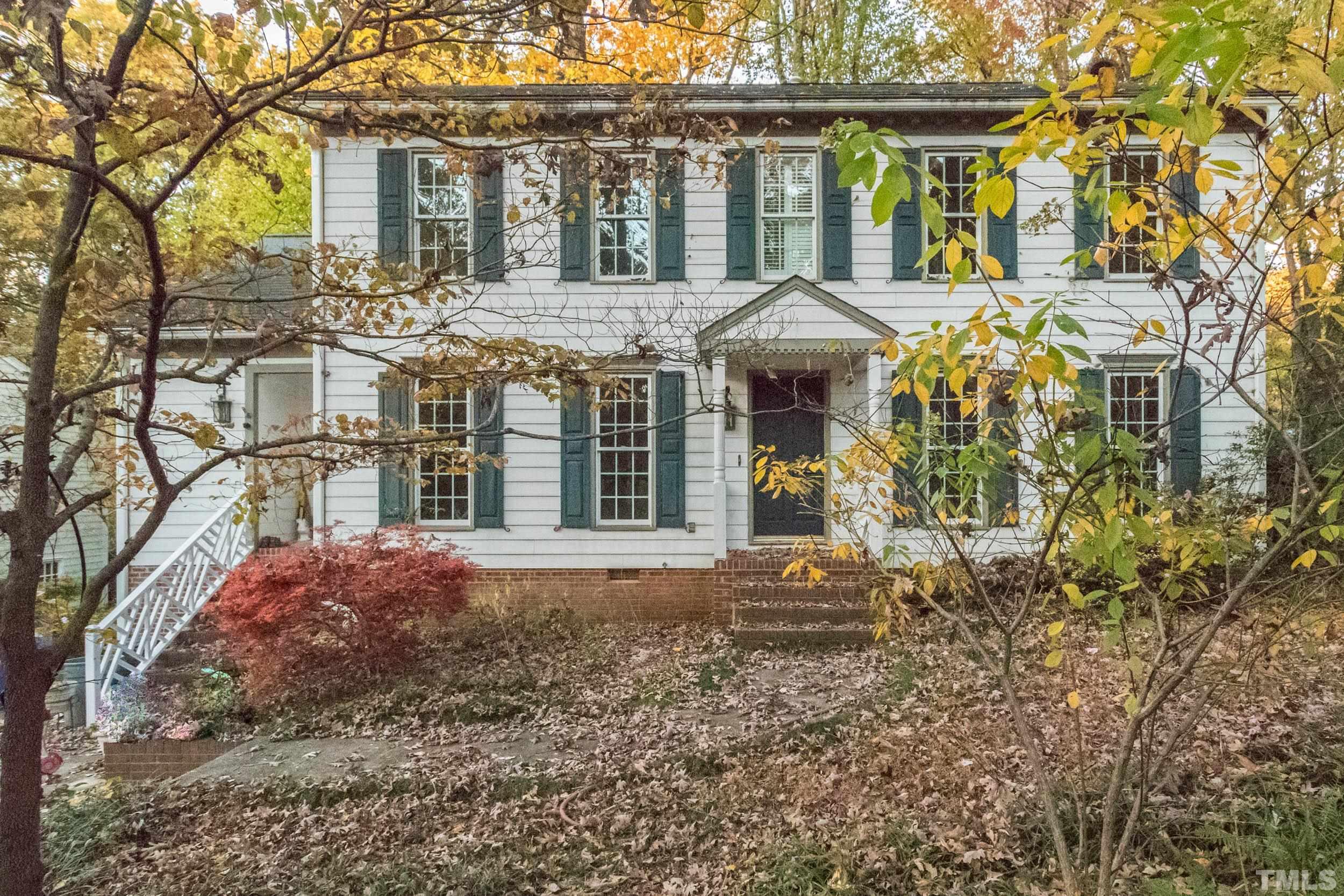 704 Blenheim Drive Raleigh, NC 27612 - Photo 2 of 23 a front view of a house with a yard