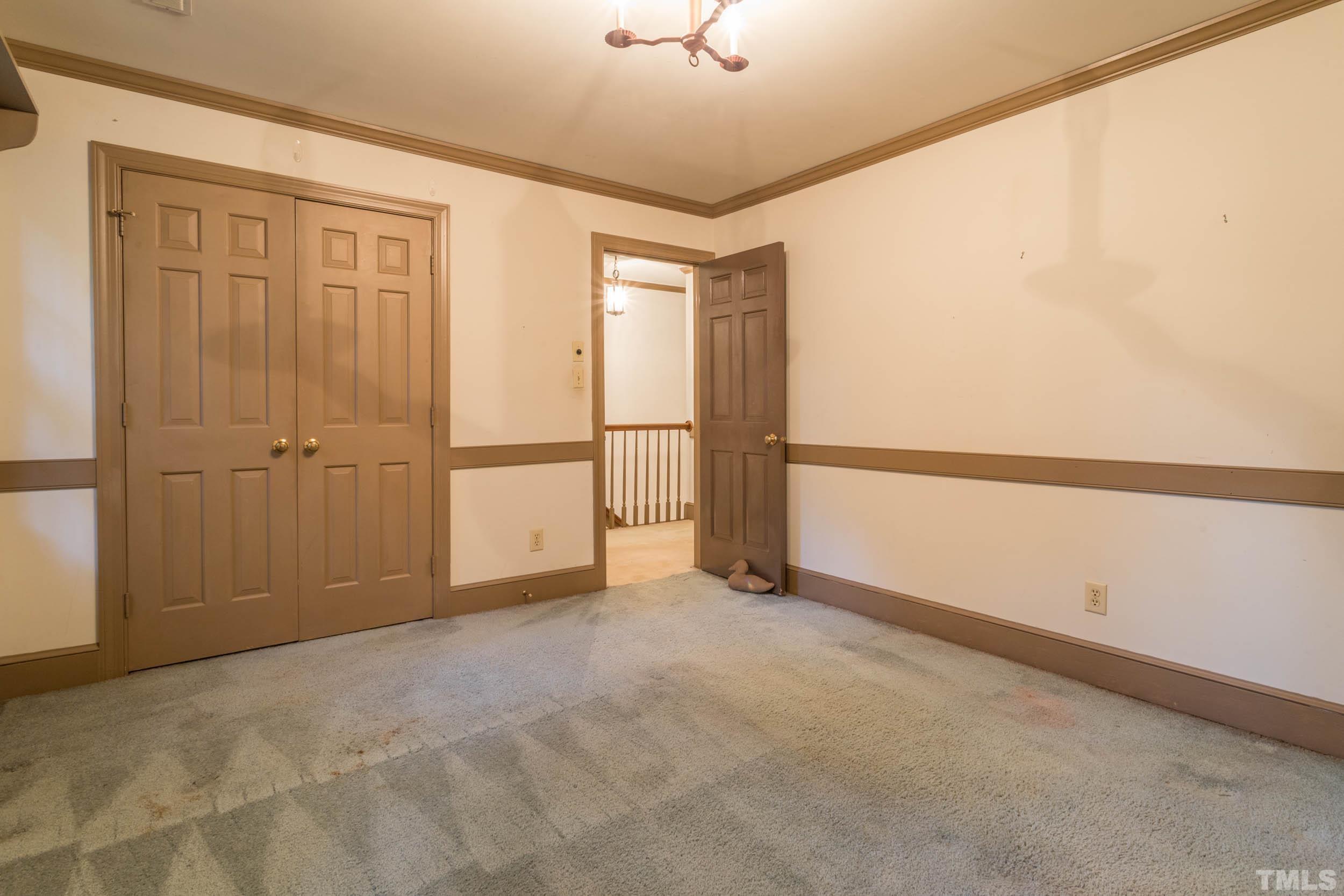 704 Blenheim Drive Raleigh, NC 27612 - Photo 16 of 23 a view of an empty room with a window