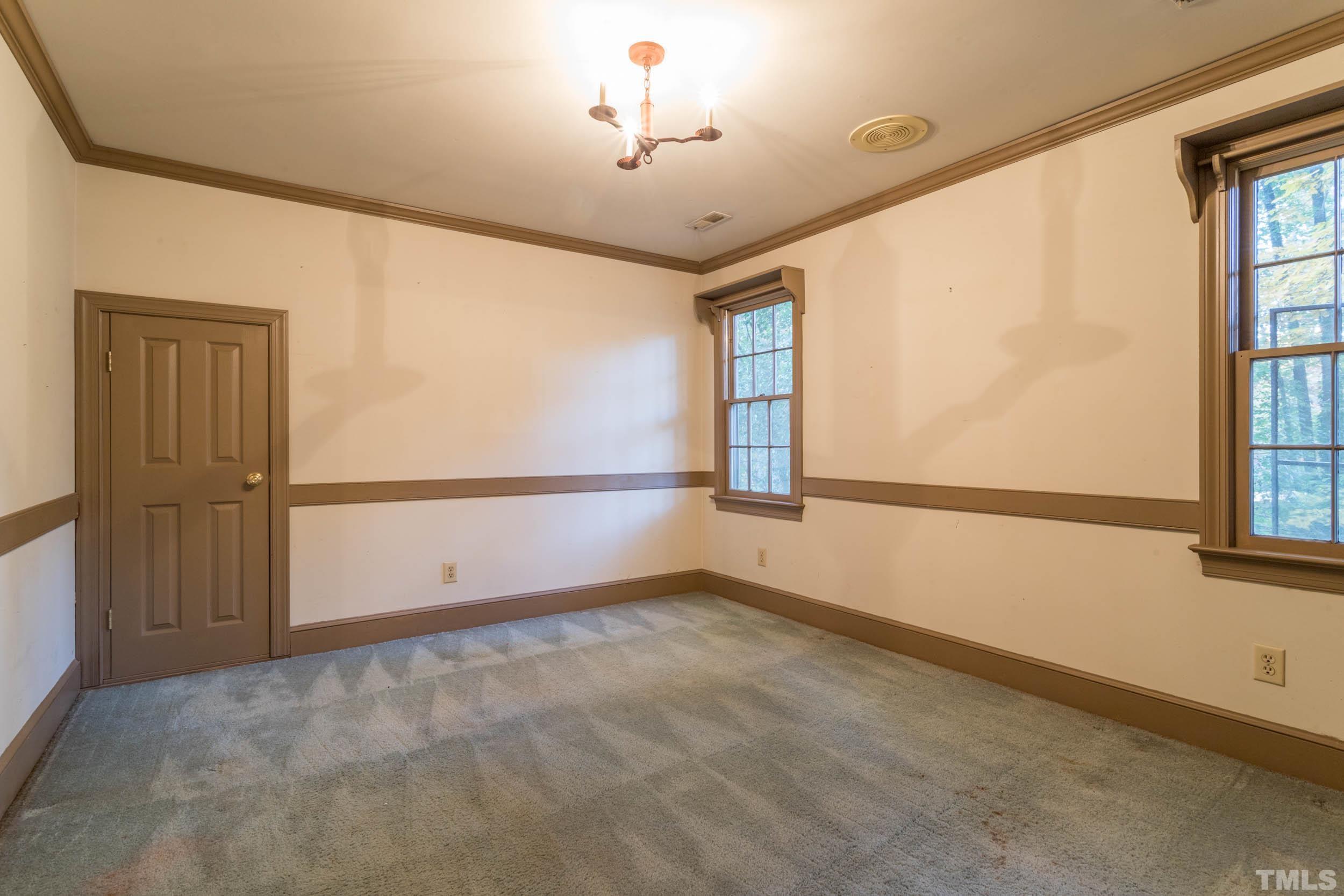 704 Blenheim Drive Raleigh, NC 27612 - Photo 17 of 23 a view of an empty room with a window