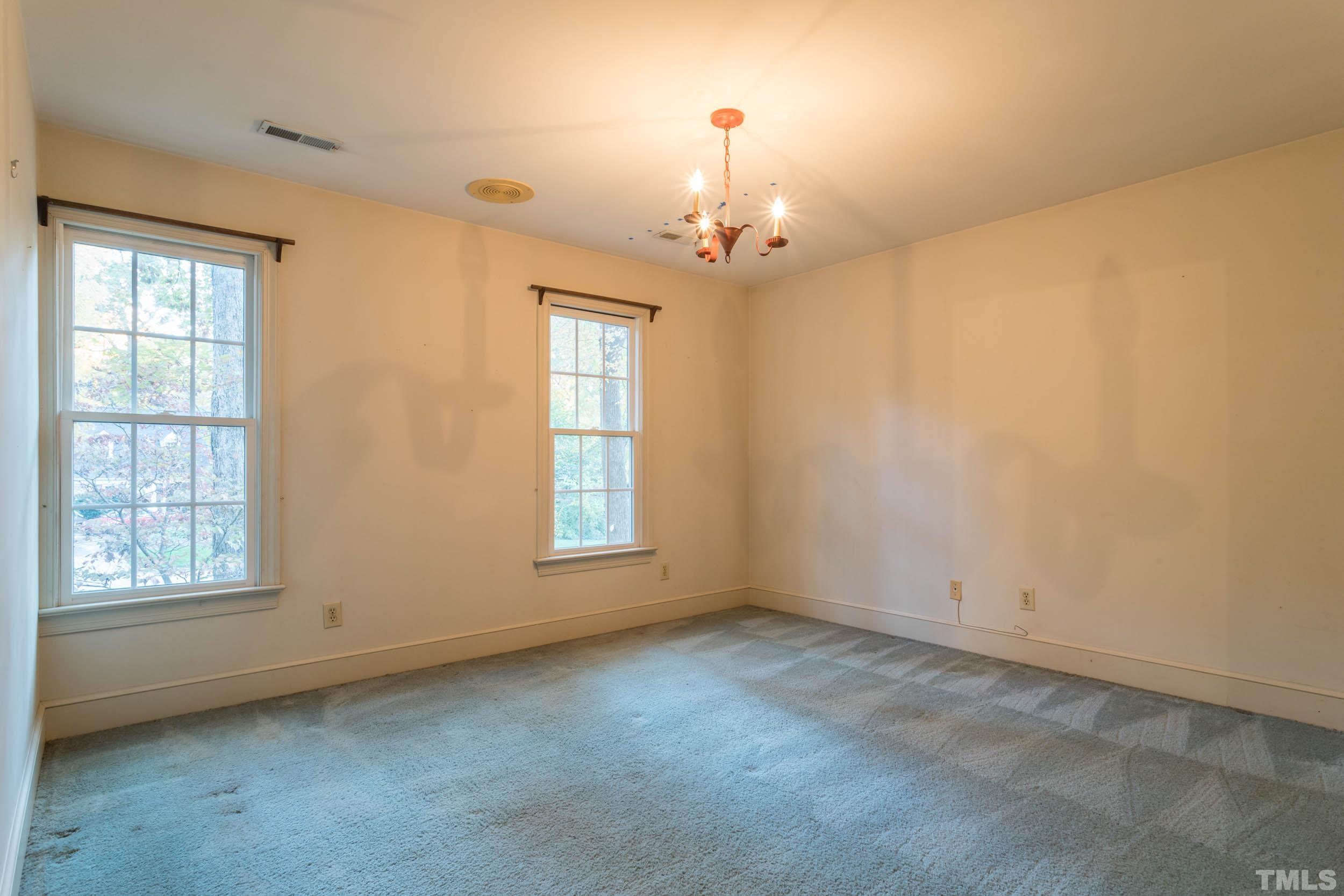 704 Blenheim Drive Raleigh, NC 27612 - Photo 19 of 23 a view of an empty room with a window