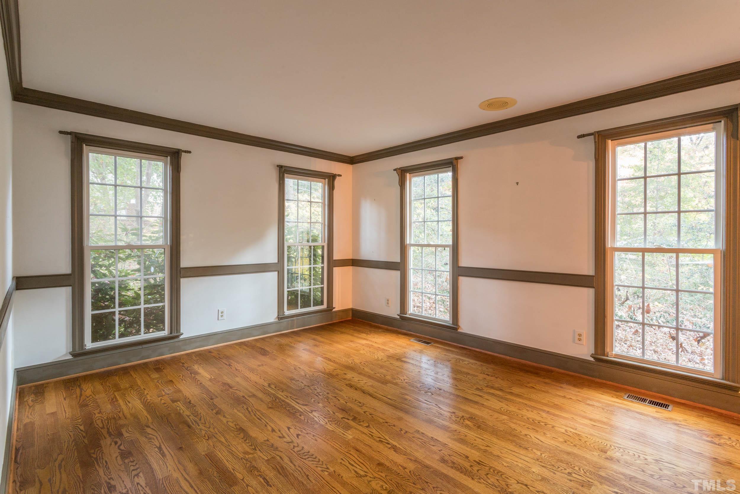 704 Blenheim Drive Raleigh, NC 27612 - Photo 4 of 23 a view of an empty room with a window
