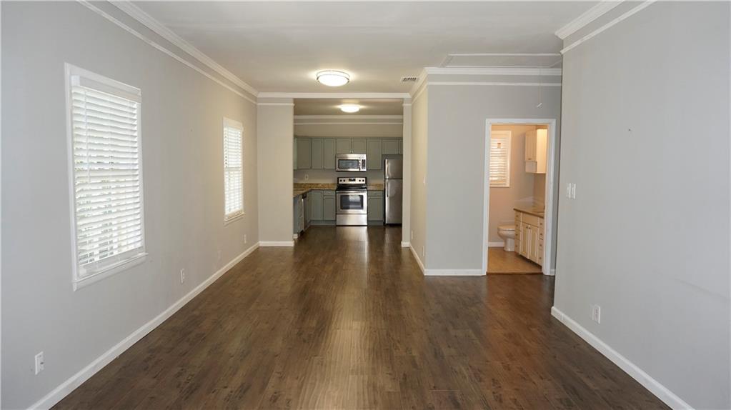 3763 Ashford Dunwoody Road Northeast Brookhaven, GA 30319 - Photo 3 of 14 a view of a hallway with wooden floor and windows