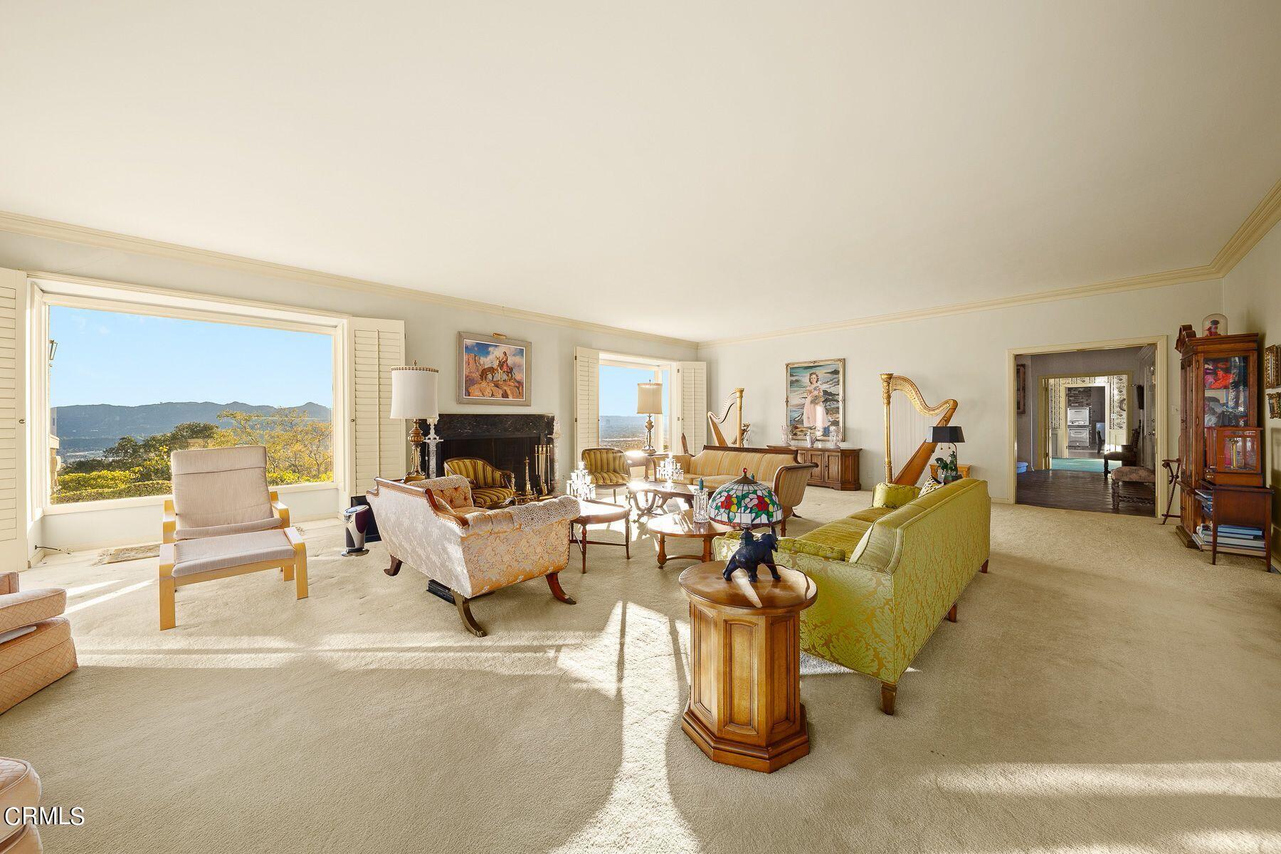 1826 Ransom Road Glendale, CA 91201 - Photo 13 of 61 a living room with furniture large window and a fireplace