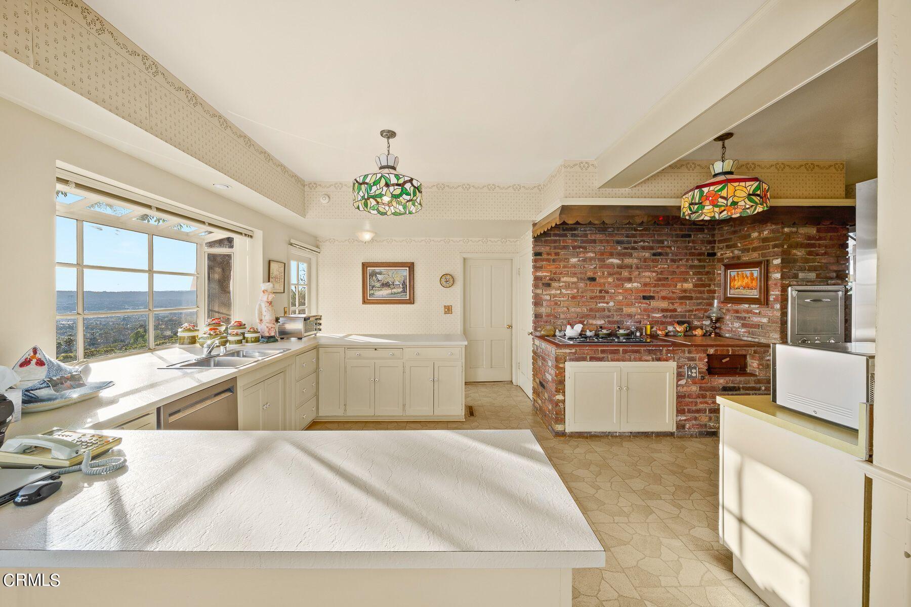 1826 Ransom Road Glendale, CA 91201 - Photo 22 of 61 a large white kitchen with a large window