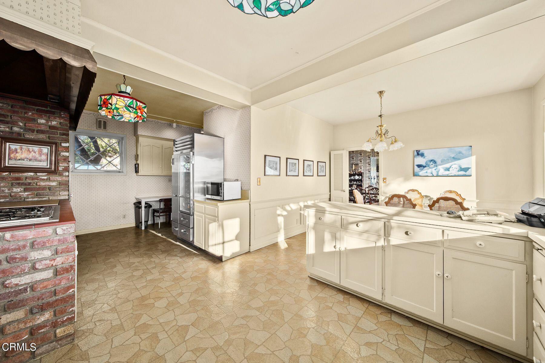 1826 Ransom Road Glendale, CA 91201 - Photo 24 of 61 a living room with stainless steel appliances kitchen island granite countertop furniture and a flat screen tv