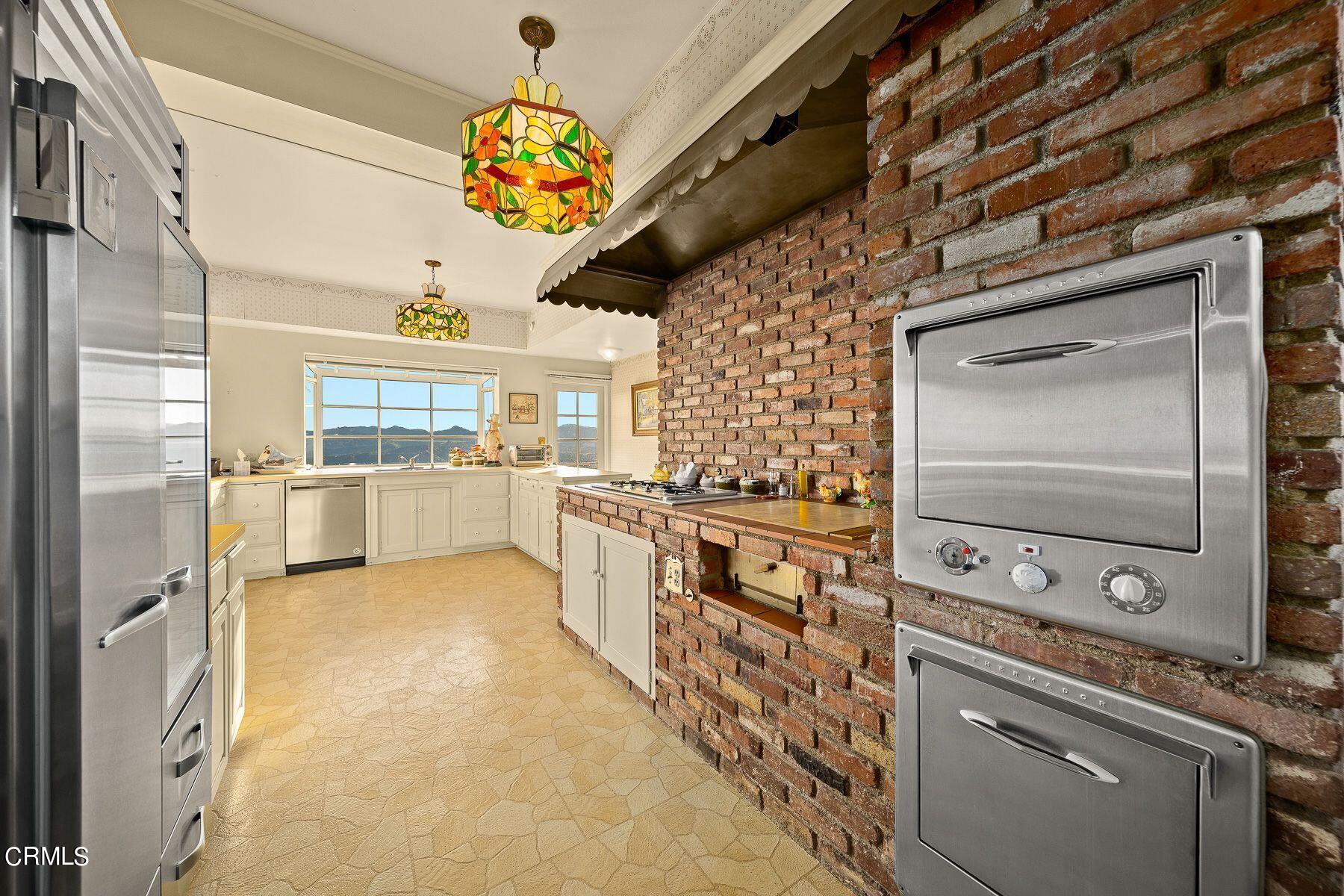 1826 Ransom Road Glendale, CA 91201 - Photo 27 of 61 a kitchen with stainless steel appliances granite countertop a stove a sink and a refrigerator