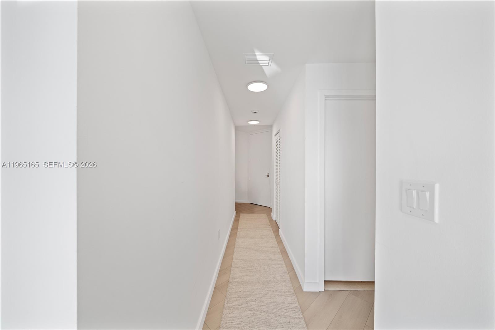 1111 Southwest 1st Avenue, Unit 2114N Miami, FL 33130 - Photo 12 of 23 a view of a hallway with wooden floor