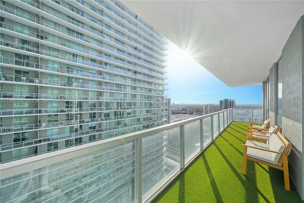 a view of balcony with furniture