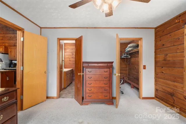 a view of a balcony with wooden floor and iron stairs