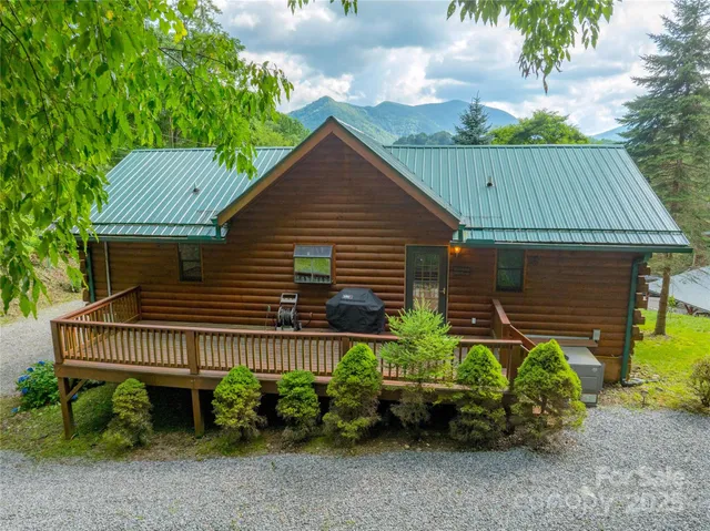 a backyard of a house with plants and outdoor seating