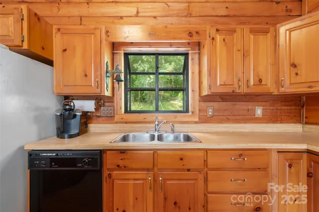a kitchen with a sink and cabinets