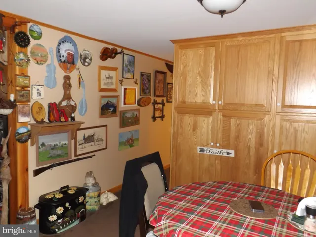 a kitchen with a table and chairs in it
