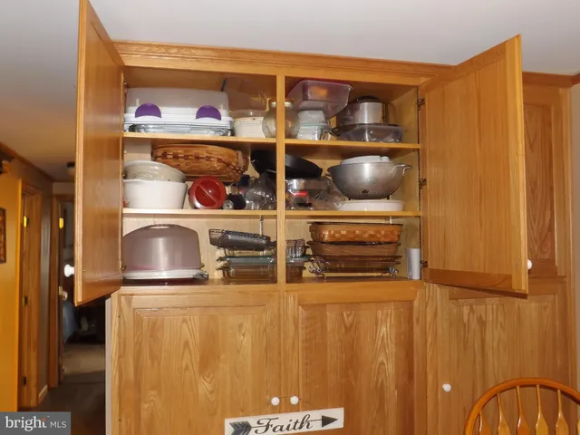 a room with lots of furniture and clothes