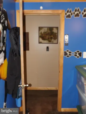 a view of a hallway with seating area and furniture