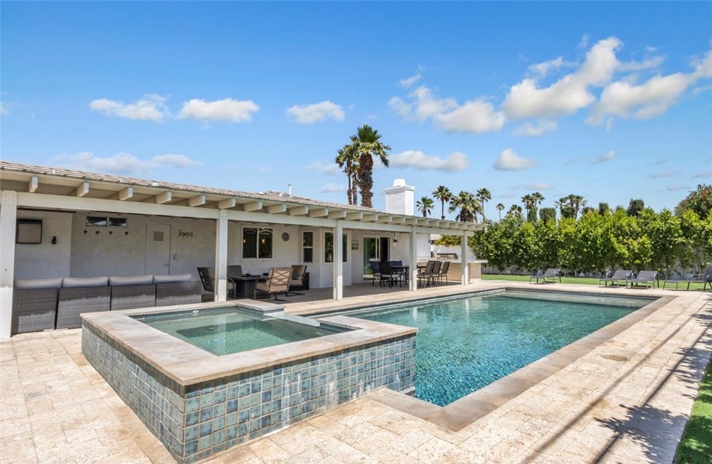 2230 North Volturno Road Palm Springs, CA 92262 - Photo 15 of 34 a front view of a house with swimming pool having outdoor seating