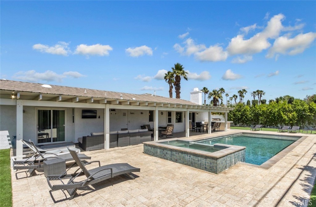 2230 North Volturno Road Palm Springs, CA 92262 - Photo 16 of 34 a view of a house with swimming pool and sitting area