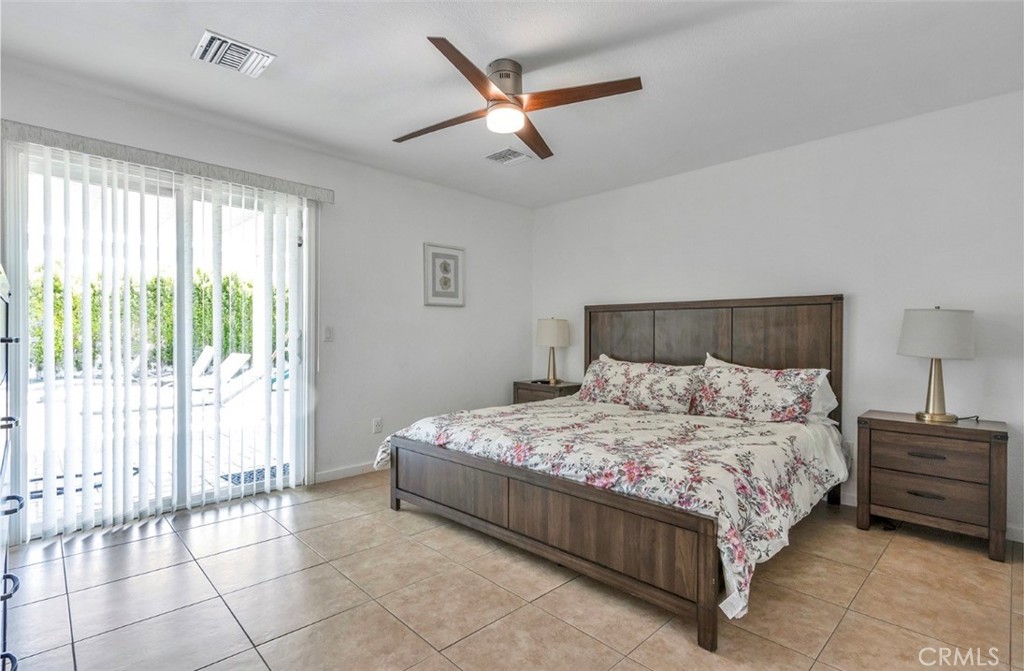 2230 North Volturno Road Palm Springs, CA 92262 - Photo 27 of 34 a bedroom with a bed and a large window