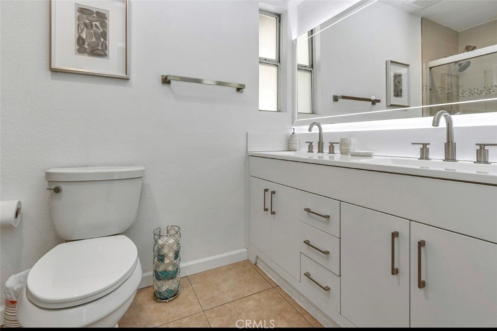 2230 North Volturno Road Palm Springs, CA 92262 - Photo 29 of 34 a bathroom with a toilet sink and mirror