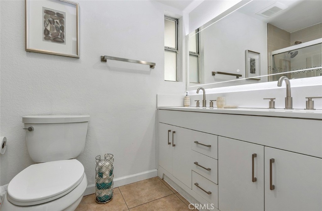 2230 North Volturno Road Palm Springs, CA 92262 - Photo 31 of 34 a bathroom with a toilet a sink and mirror
