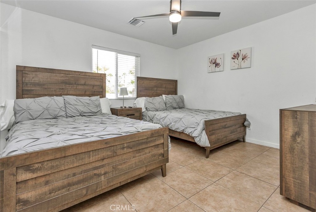 2230 North Volturno Road Palm Springs, CA 92262 - Photo 34 of 34 a bedroom with a bed and a walk in closet