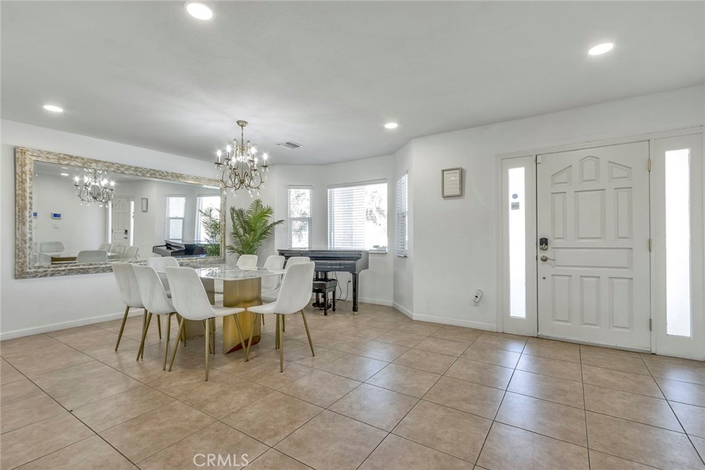 2230 North Volturno Road Palm Springs, CA 92262 - Photo 4 of 34 a view of a dining room with furniture and chandelier