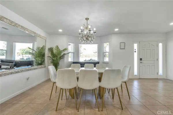 a view of a dining room with furniture and window